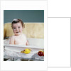 1960s smiling baby in bath looking at camera by Anonymous
