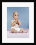 1960s baby wearing cloth diaper sitting with hands together thoughtful pose expression by Anonymous