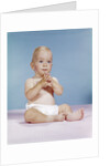 1960s baby wearing cloth diaper sitting with hands together thoughtful pose expression by Anonymous