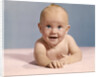 1970s smiling happy baby crawling straight ahead on pink blanket looking at camera by Anonymous