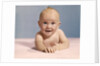 1970s smiling happy baby crawling straight ahead on pink blanket looking at camera by Anonymous