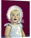 1960s blonde baby blue eyes wearing ruffled bonnet facial expression of wonder looking at camera by Anonymous