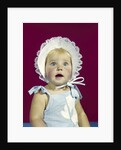 1960s blonde baby blue eyes wearing ruffled bonnet facial expression of wonder looking at camera by Anonymous