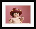 1960s baby making face wearing red straw hat by Anonymous