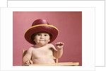 1960s baby making face wearing red straw hat by Anonymous
