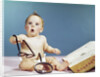 1960s baby holding eyeglasses with open dictionary and magnifying glass research by Anonymous