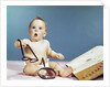 1960s baby holding eyeglasses with open dictionary and magnifying glass research by Anonymous