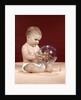 1960s baby sitting holding clear plastic toy ball with butterflies inside by Anonymous
