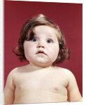 1960s portrait brunette baby girl with chubby round face uncertain facial expression looking at camera by Anonymous