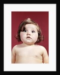 1960s portrait brunette baby girl with chubby round face uncertain facial expression looking at camera by Anonymous