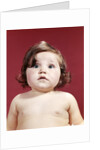 1960s portrait brunette baby girl with chubby round face uncertain facial expression looking at camera by Anonymous