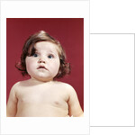 1960s portrait brunette baby girl with chubby round face uncertain facial expression looking at camera by Anonymous