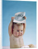 1960s baby holding budget sign above his head by Anonymous