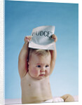 1960s baby holding budget sign above his head by Anonymous