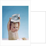 1960s baby holding budget sign above his head by Anonymous