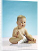 1960s baby sitting holding on to his feet by Anonymous
