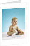 1960s baby sitting holding on to his feet by Anonymous