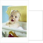 1960s happy baby taking bath by Anonymous