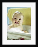 1960s smiling baby in bath looking up by Anonymous