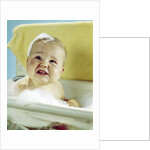 1960s smiling baby in bath looking up by Anonymous