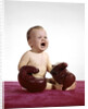 1960s crying baby wearing large boxing gloves by Anonymous
