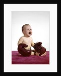 1960s crying baby wearing large boxing gloves by Anonymous