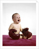 1960s crying baby wearing large boxing gloves by Anonymous