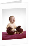 1960s crying baby wearing large boxing gloves by Anonymous