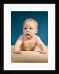 1960s baby big blue eyes raised up on arms looking to side by Anonymous