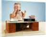 1960s baby businessman diaper sitting at loan desk wearing eyeglasses talking on telephone by Anonymous
