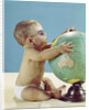 1960s baby wearing eyeglasses hugging the world globe earth by Anonymous