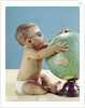 1960s baby wearing eyeglasses hugging the world globe earth by Anonymous