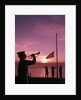 1960s boy scout blowing bugle as others raise american flag at camp sunset ceremony by Anonymous