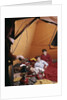 1960s father with lantern checking up on 3 boys in sleeping bags pajamas in tent by Anonymous
