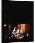 1960s night scene family gazing into campfire by tent by Anonymous