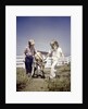 1940s 1950s boy girl leading young calf on farm by Anonymous