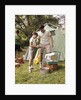 1960s three boys at campsite cooking camp stove eating food tent teens by Anonymous
