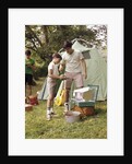 1960s three boys at campsite cooking camp stove eating food tent teens by Anonymous