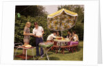1970s group teenagers boys girls backyard grilling table umbrella by Anonymous