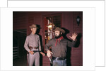 1960s 1970s western sheriff arrests bearded cowboy about to draw gun by Anonymous