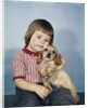 1950s 1960s winsome sad little girl sitting hugging a cocker spaniel puppy studio by Anonymous
