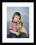 1950s 1960s winsome sad little girl sitting hugging a cocker spaniel puppy studio by Anonymous