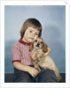 1950s 1960s winsome sad little girl sitting hugging a cocker spaniel puppy studio by Anonymous