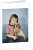 1950s 1960s winsome sad little girl sitting hugging a cocker spaniel puppy studio by Anonymous