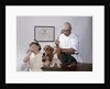1960s little girl hiding eyes with as pet basset hound gets injection from veterinarian by Anonymous