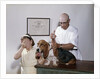 1960s little girl hiding eyes with as pet basset hound gets injection from veterinarian by Anonymous