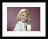 1960s girl glass milk dairy smile looking at camera by Anonymous