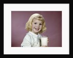 1960s girl glass milk dairy smile looking at camera by Anonymous