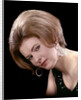 1960s portrait serious woman black sequin evening diamond earrings dress bouffant hairstyle looking at camera by Anonymous