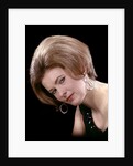 1960s portrait serious woman black sequin evening diamond earrings dress bouffant hairstyle looking at camera by Anonymous